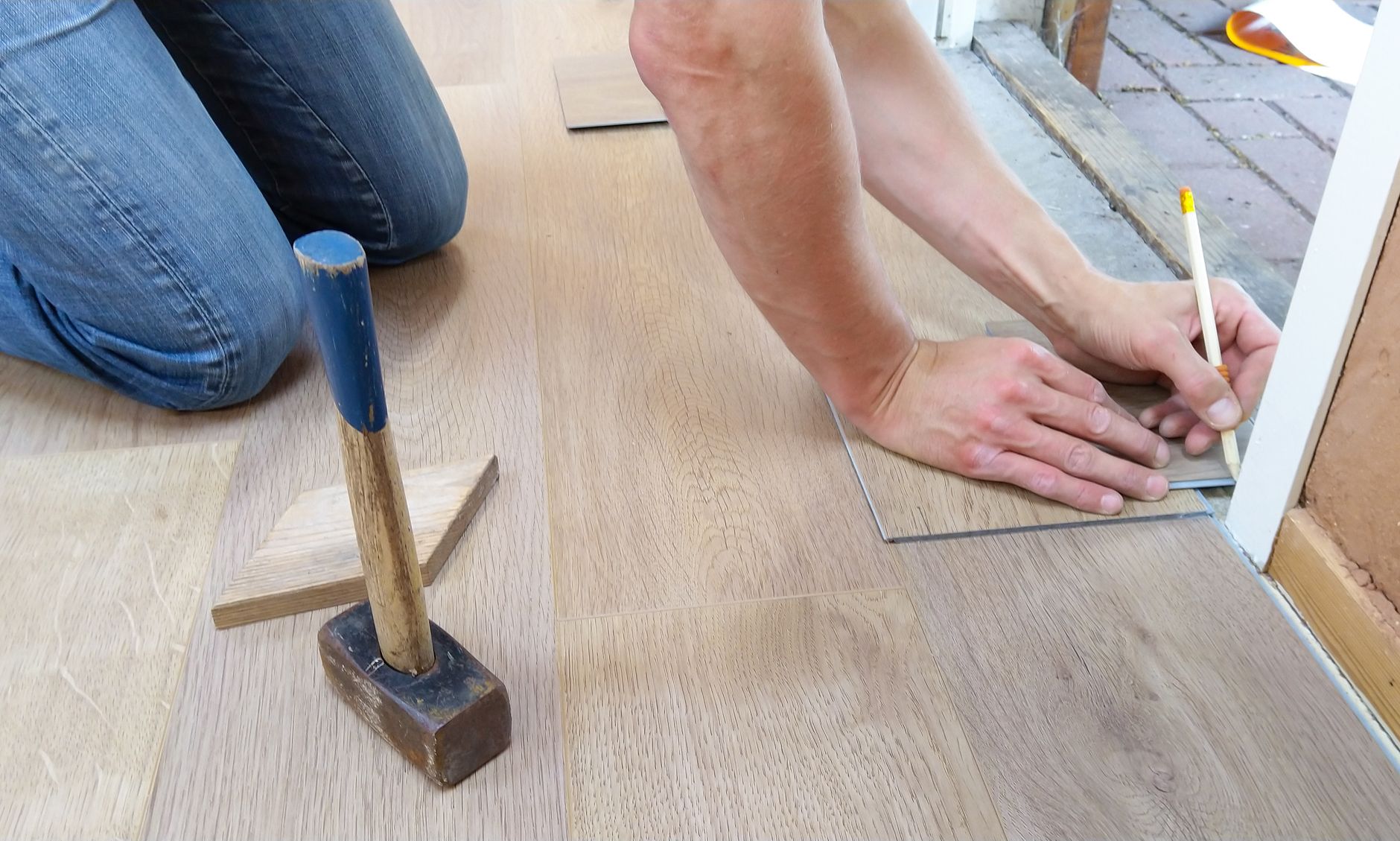 Laminate flooring installation during a home renovation