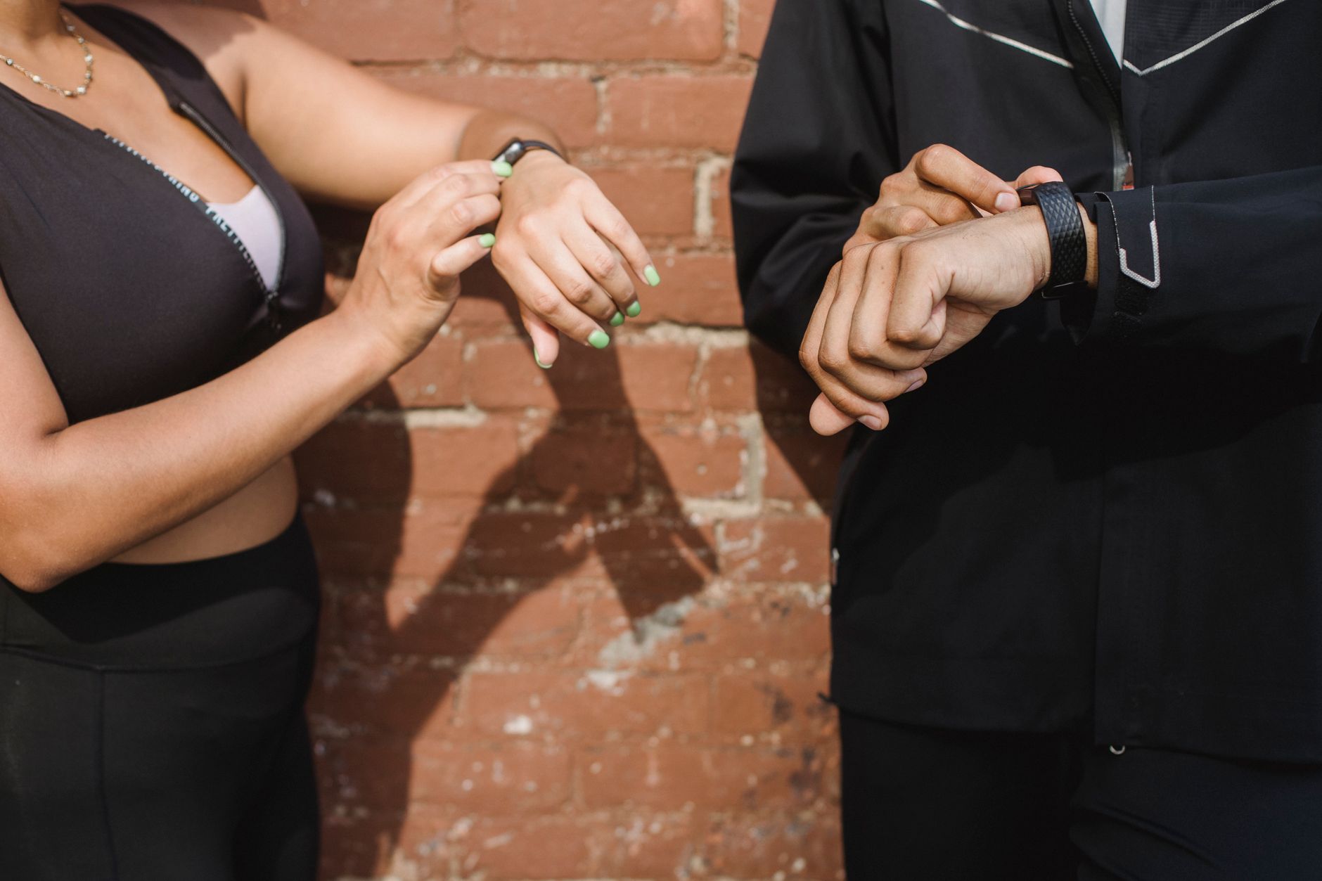 Fitness tracker on wrist showing daily steps and exercise data