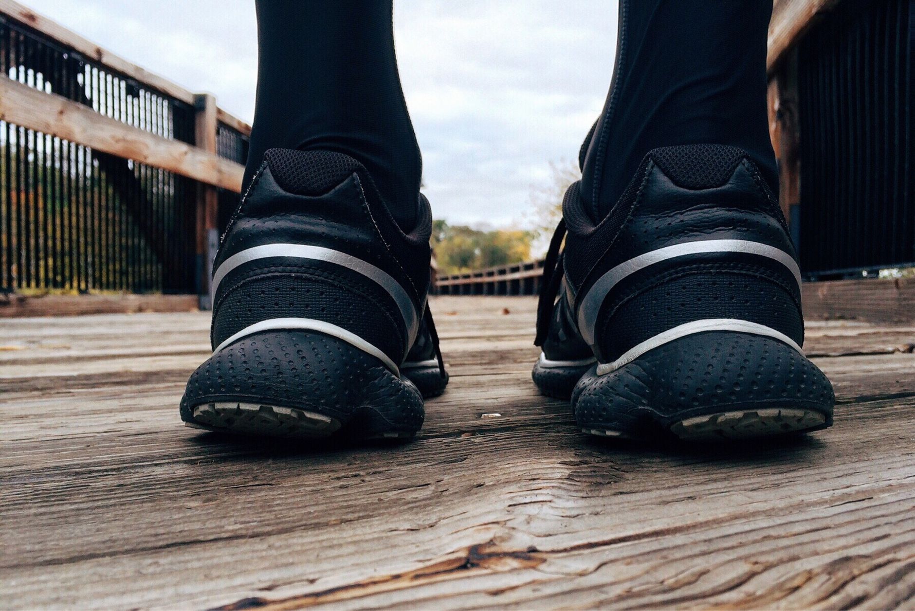 Running shoes on outdoor trail for exercise and fitness walking