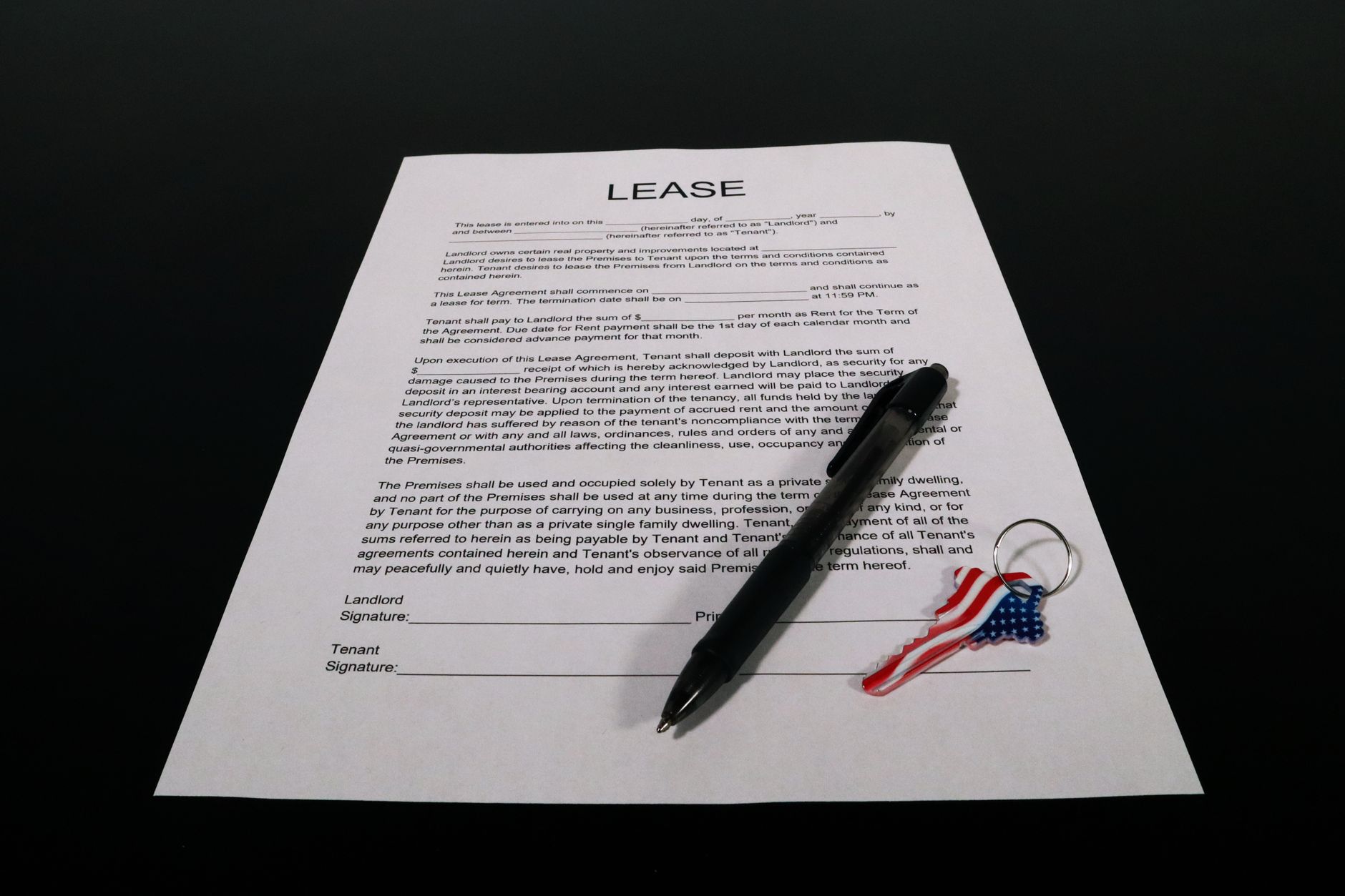 Signing a car lease contract at a dealership desk