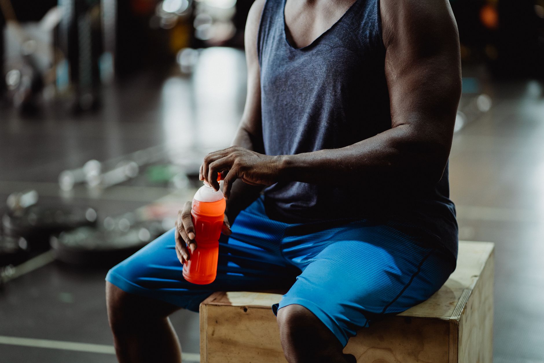 Athlete training in gym to build muscle with proper protein nutrition