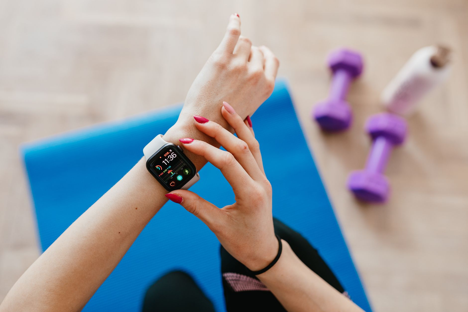 Runner monitoring heart rate during outdoor exercise