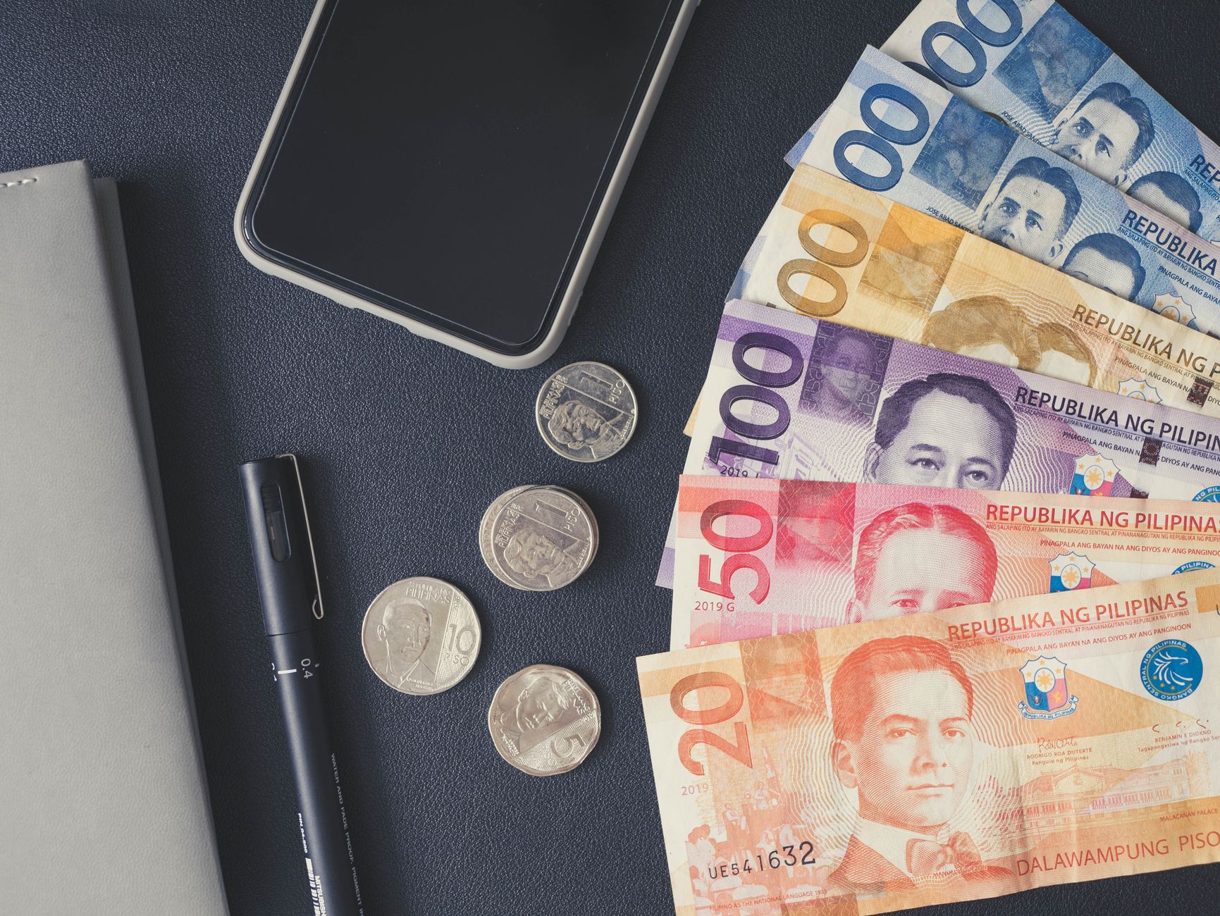 Currency exchange money and coins on a table