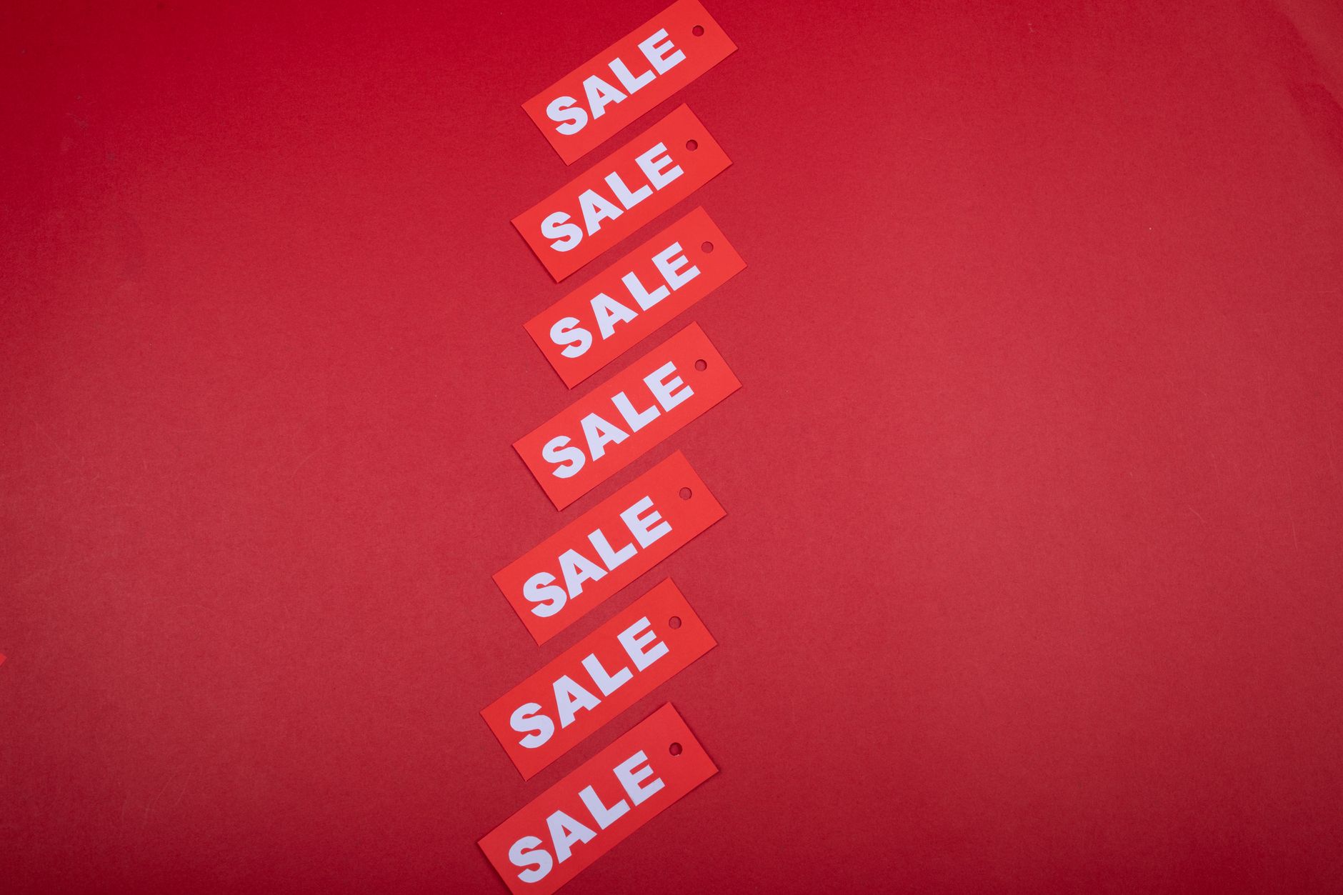 Sale tags showing percentage discount on retail items