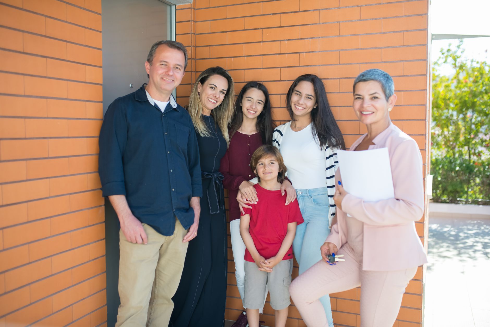 Family moving into their new home after using a mortgage affordability calculator