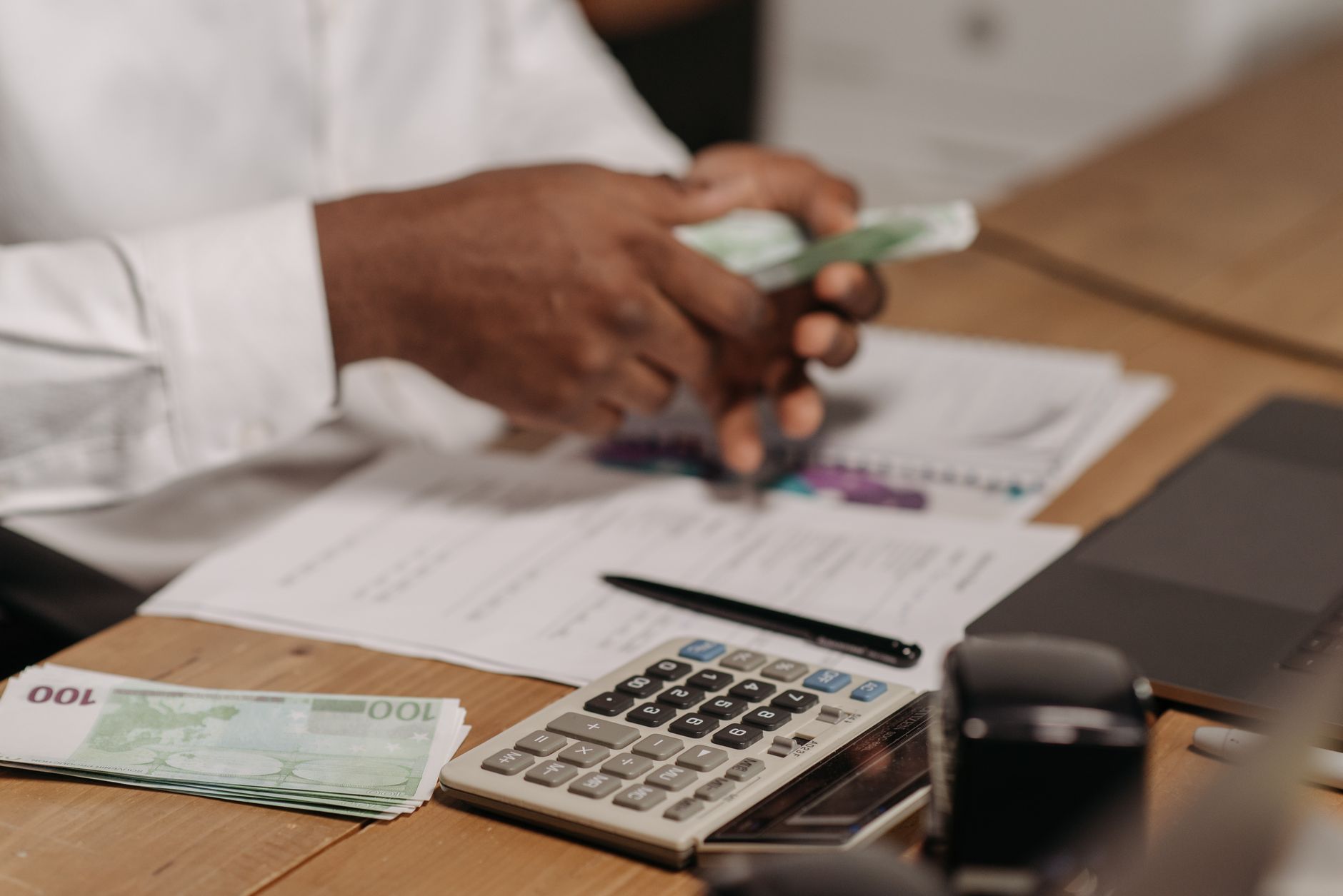 Calculator and money representing finance planning and budgeting