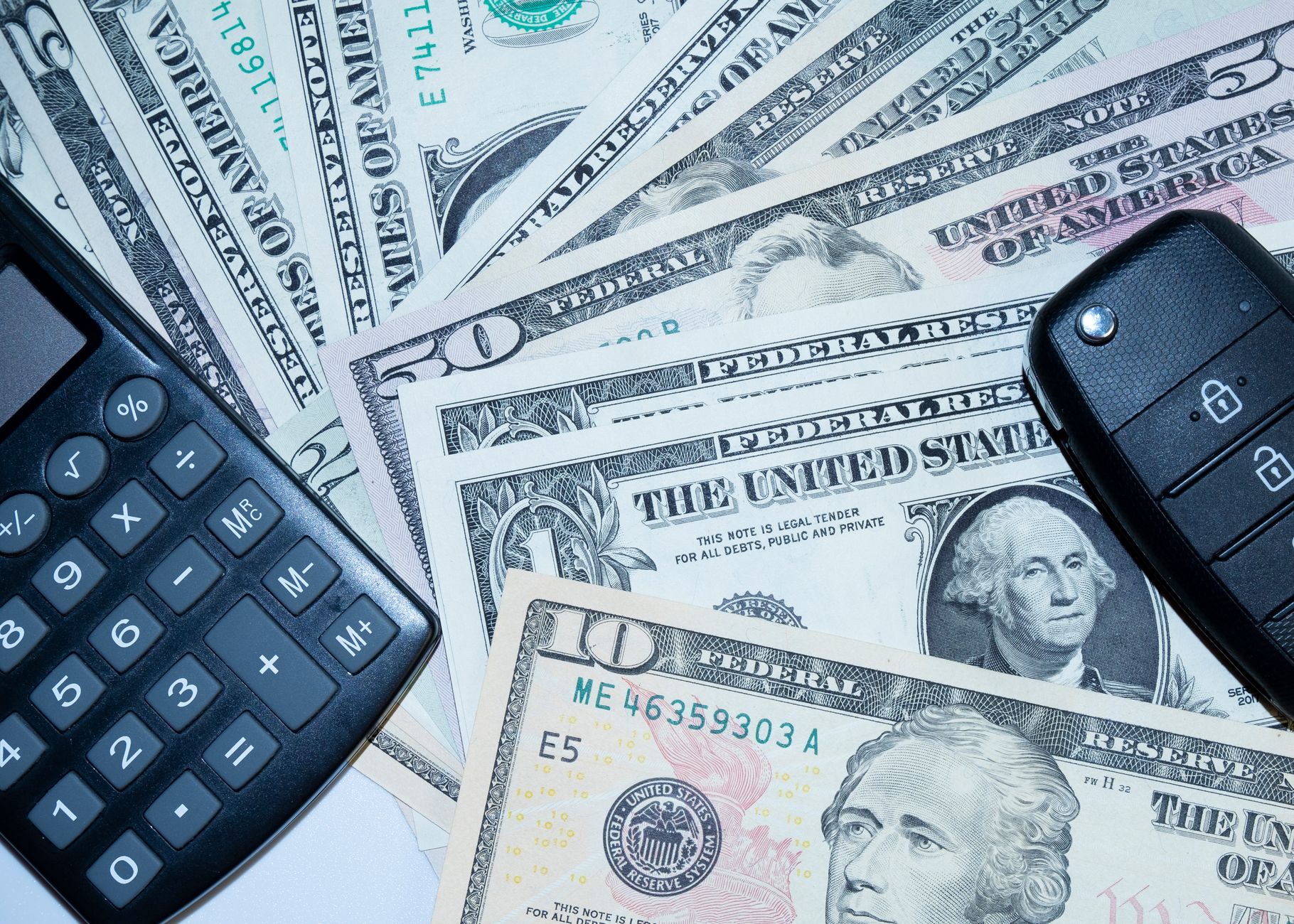 Bank calculator and financial documents used to compute loan and deposit interest