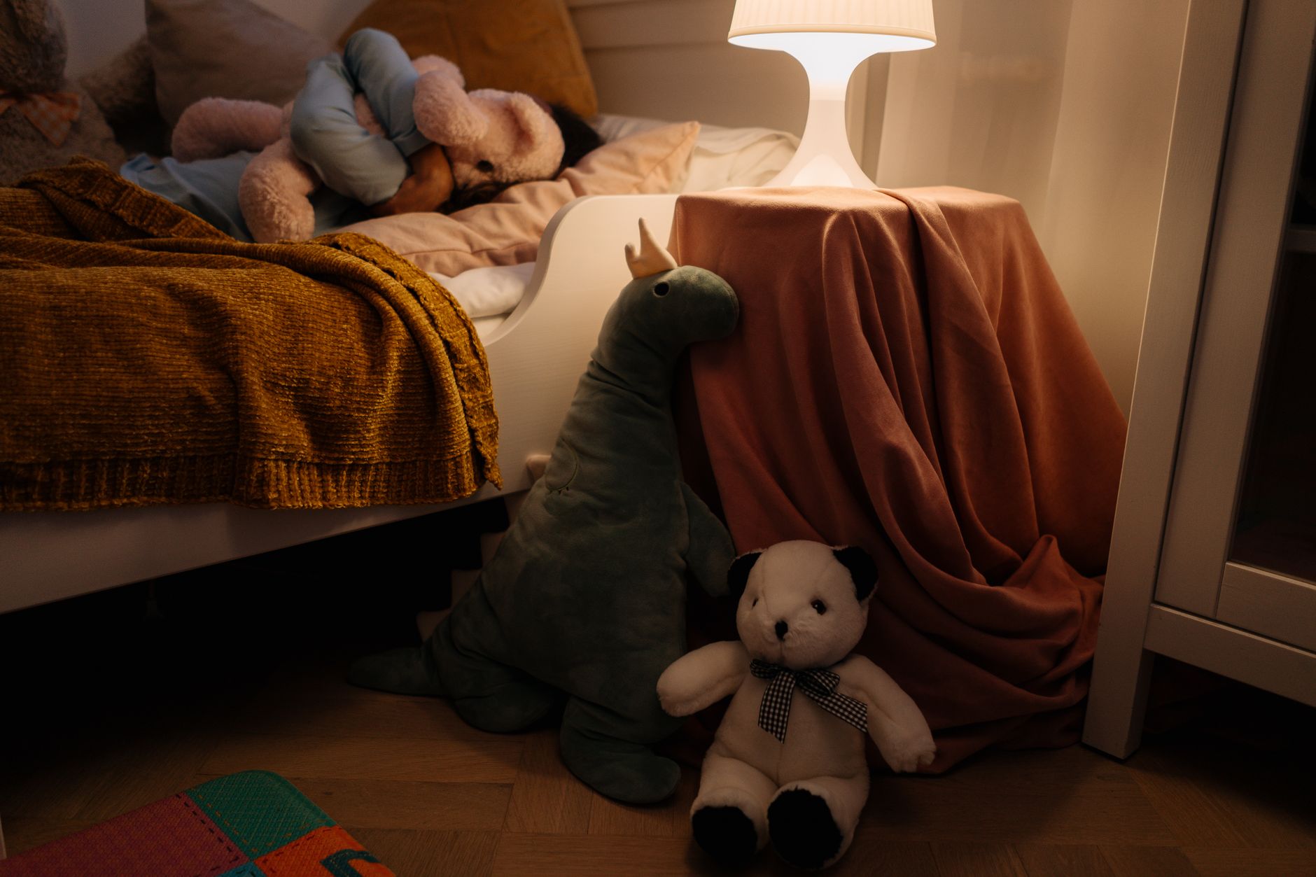 Cozy bedroom with warm lighting and comfortable bedding