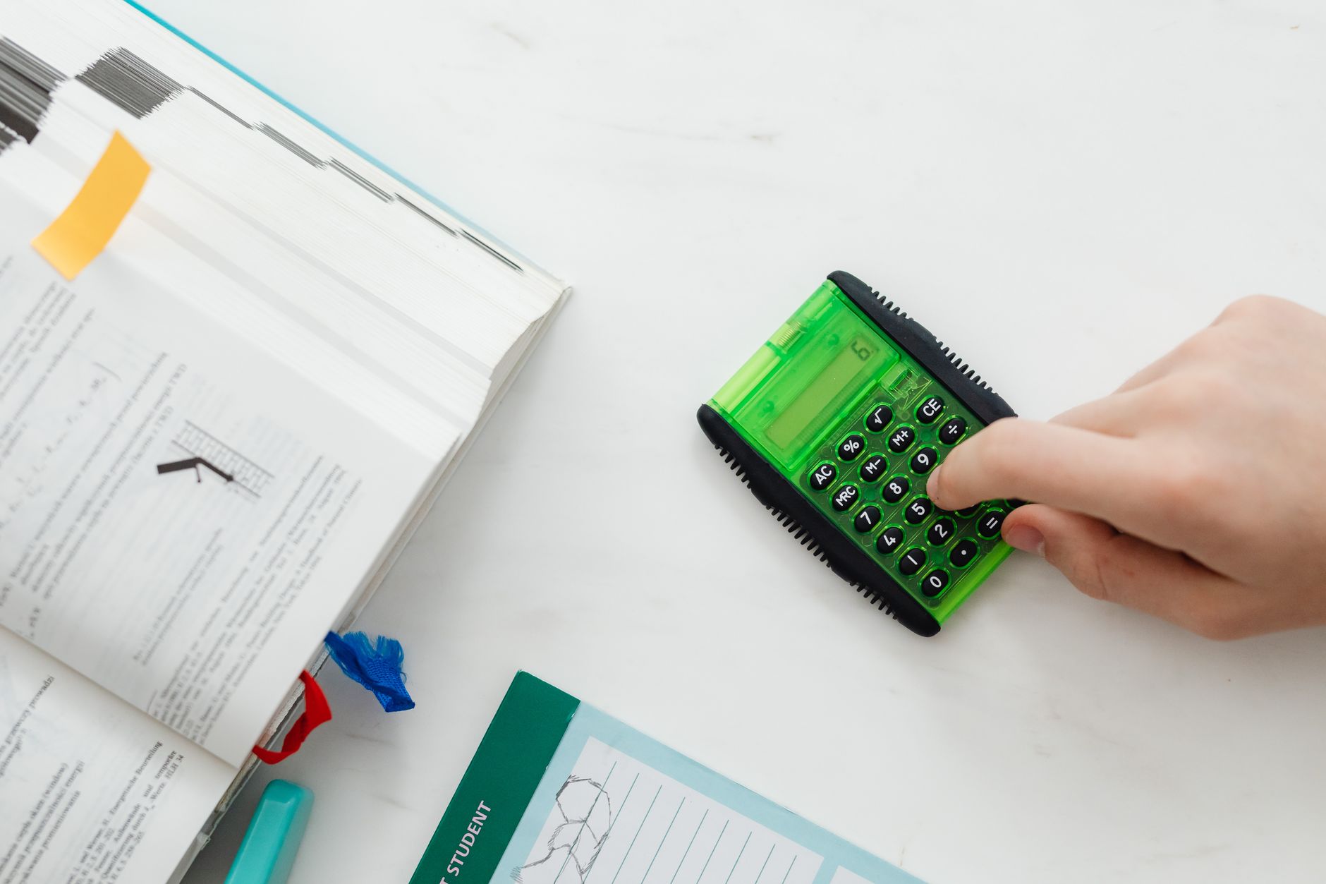 Student doing math homework with a calculator