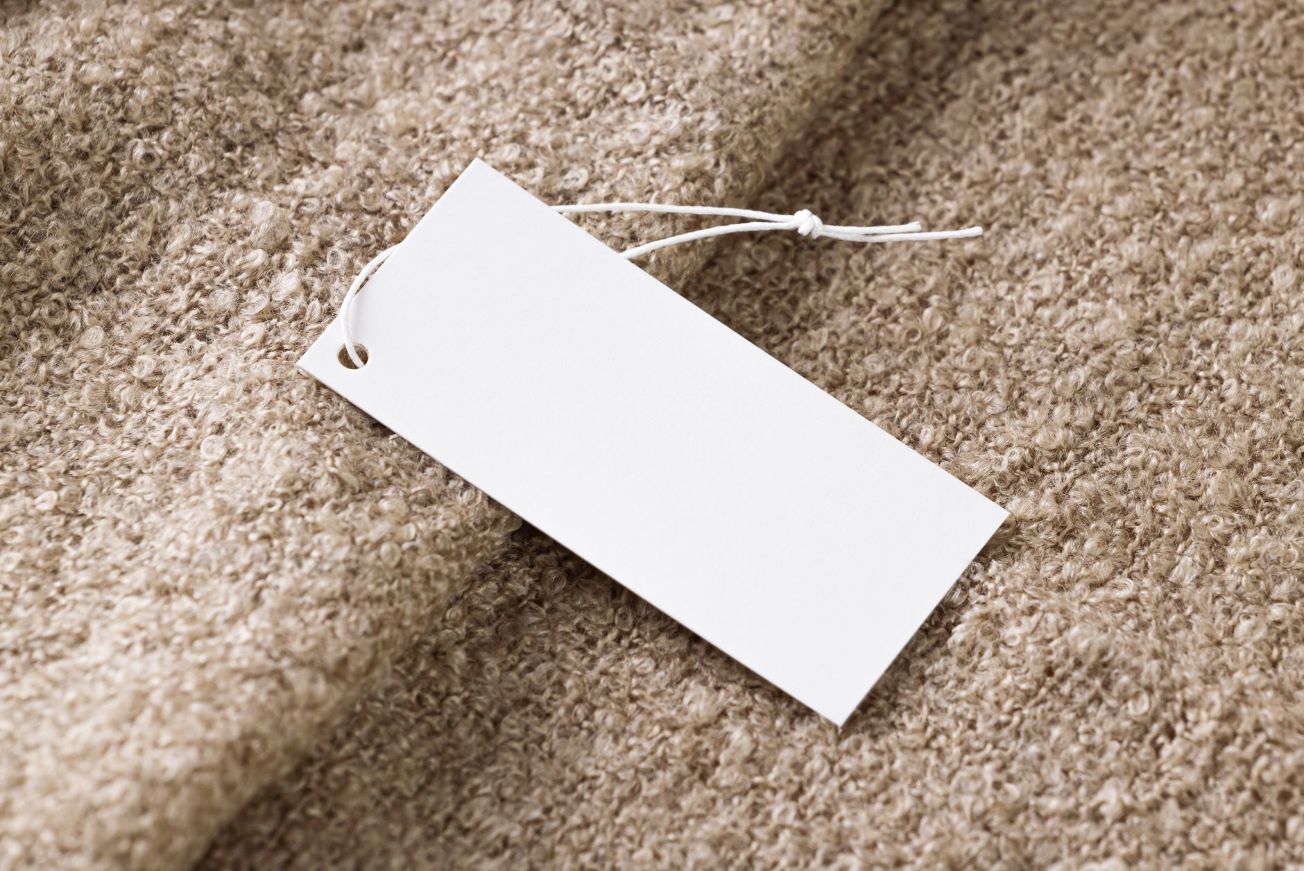Retail store price tags showing product markup and selling prices