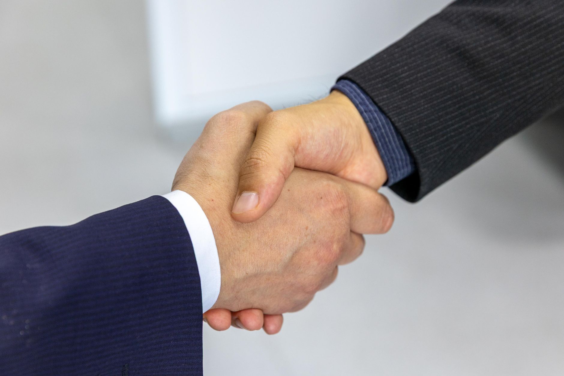 Business professionals discussing a salary raise percentage in an office