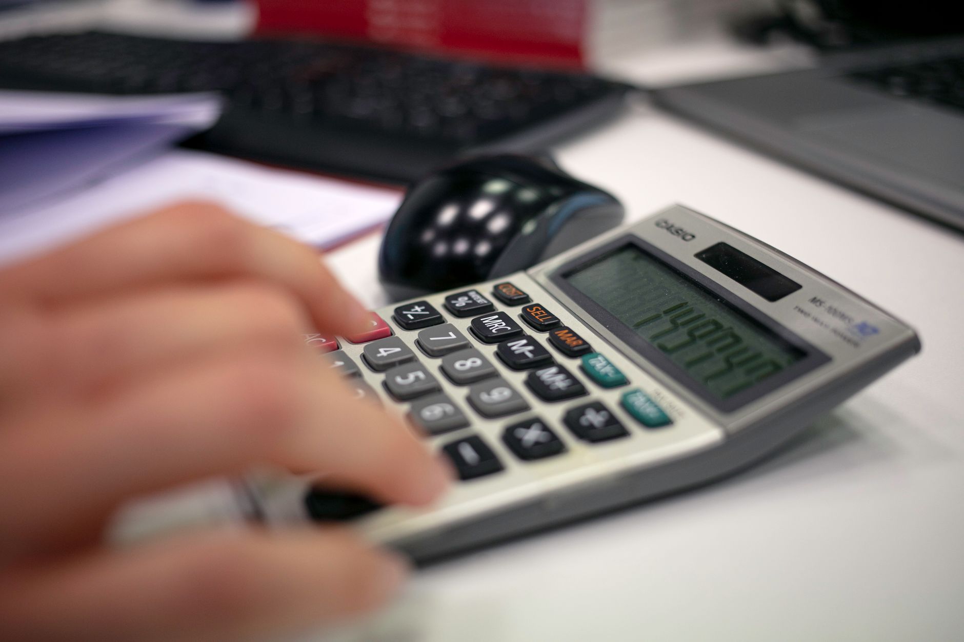 Office worker calculating overtime pay