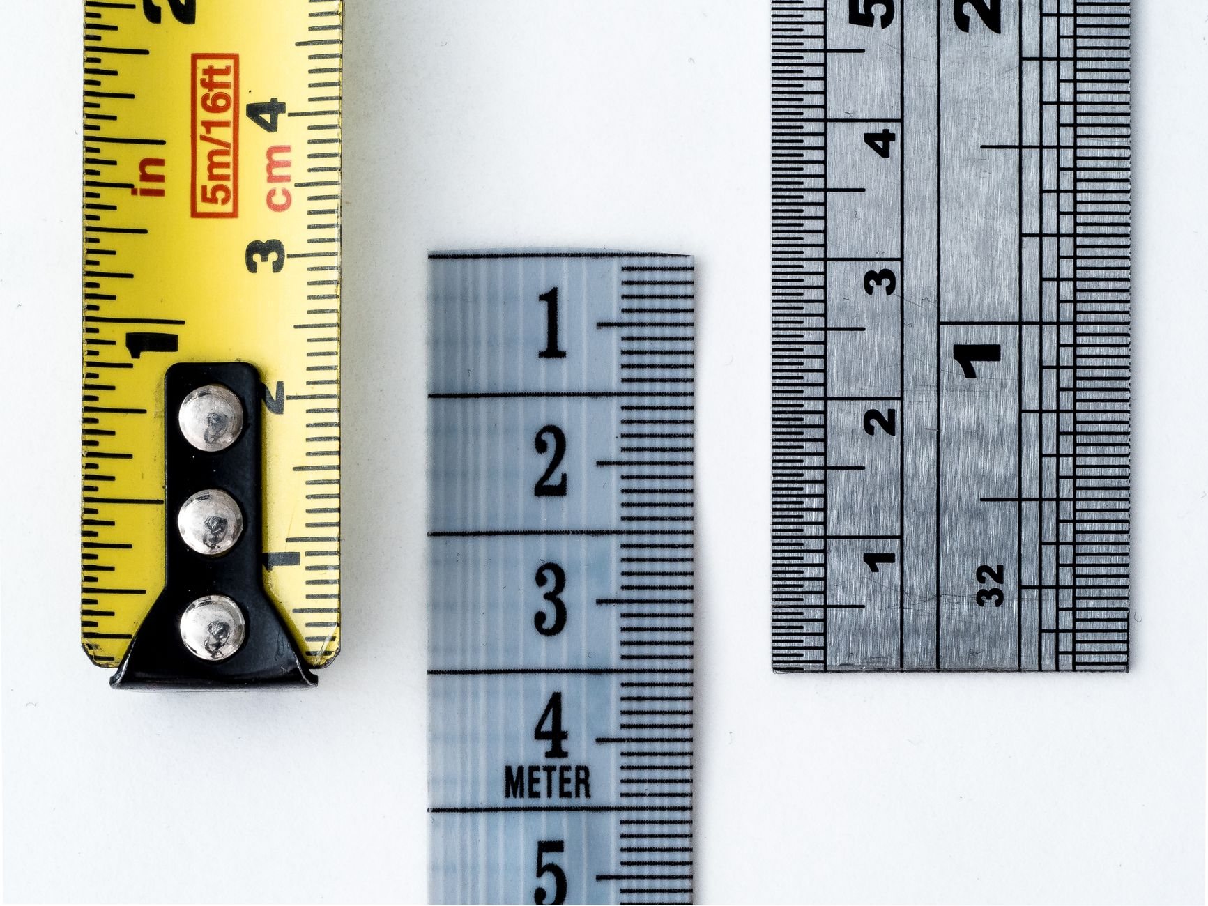 Measuring tape and ruler showing metric and imperial units