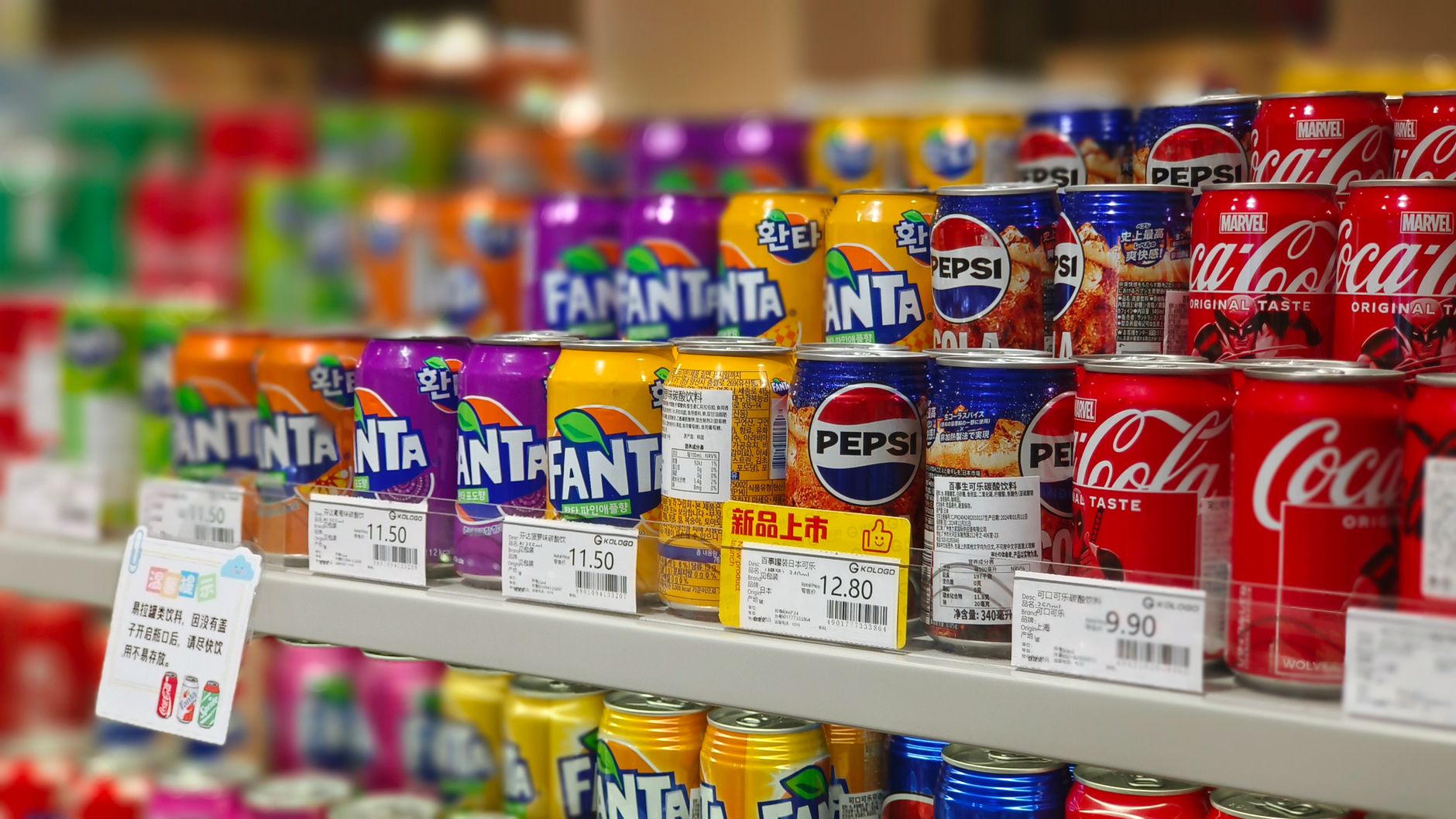 Grocery store shelf labels showing unit price information