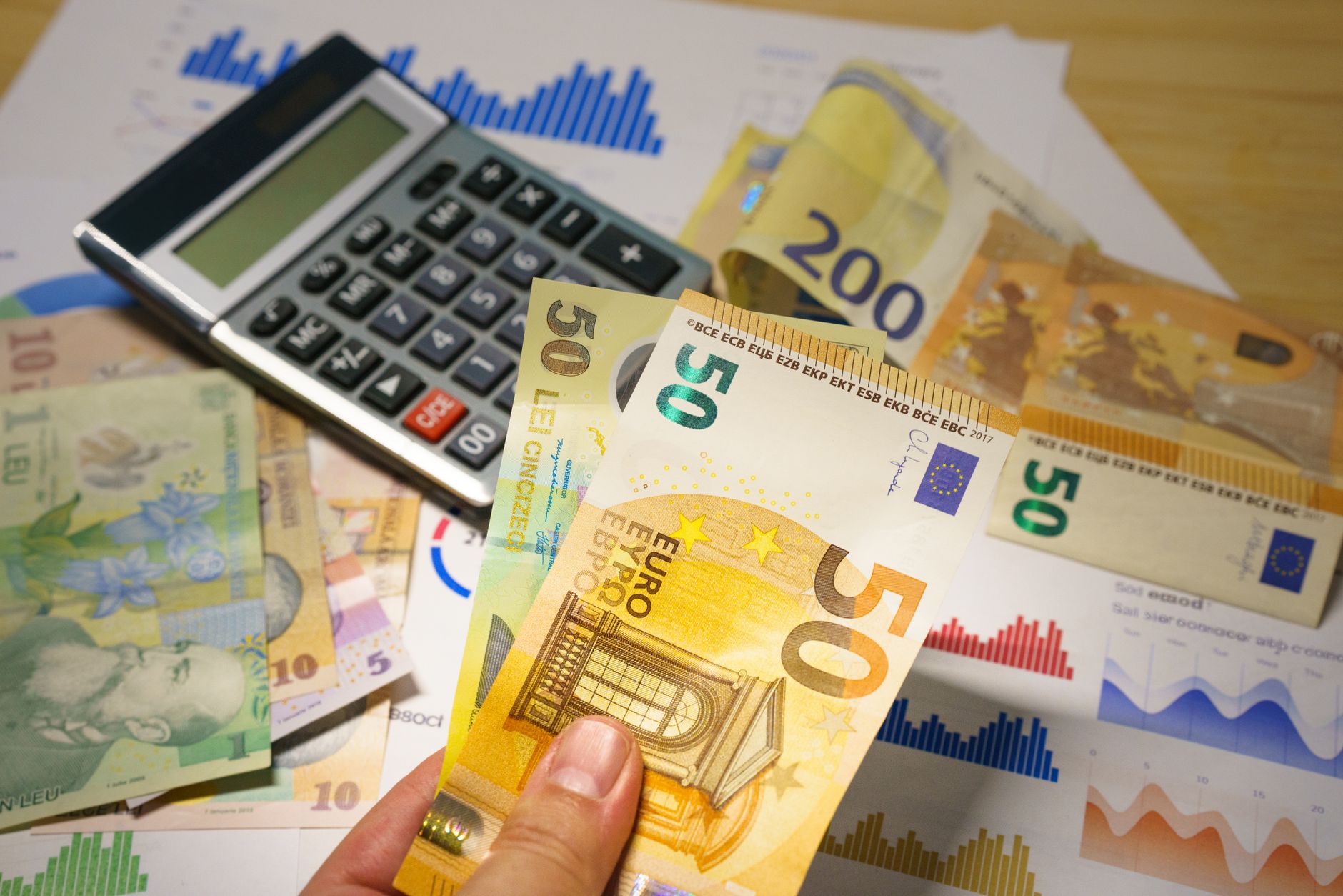 Calculator and budget planning tools on a desk